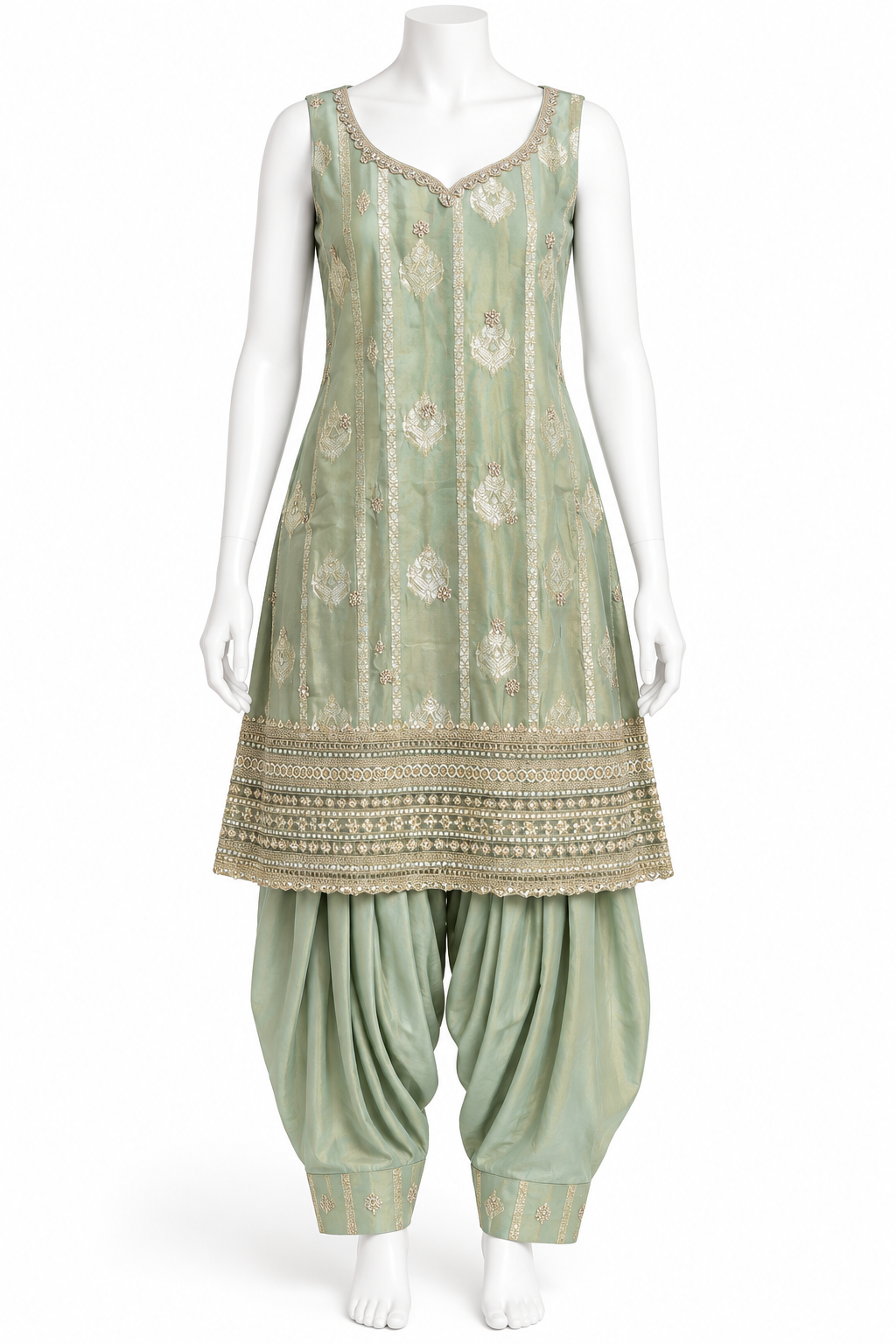 A sage green traditional Indian outfit displayed on a white mannequin, featuring a sleeveless kurta with gold embroidery and a flared pant leg.