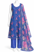 A blue three-piece salwar kameez suit set displayed on a white mannequin. The set includes a sleeveless blue kameez top with pink floral embroidery, matching blue trousers, and a sheer blue dupatta with large pink floral prints and a gold border.
