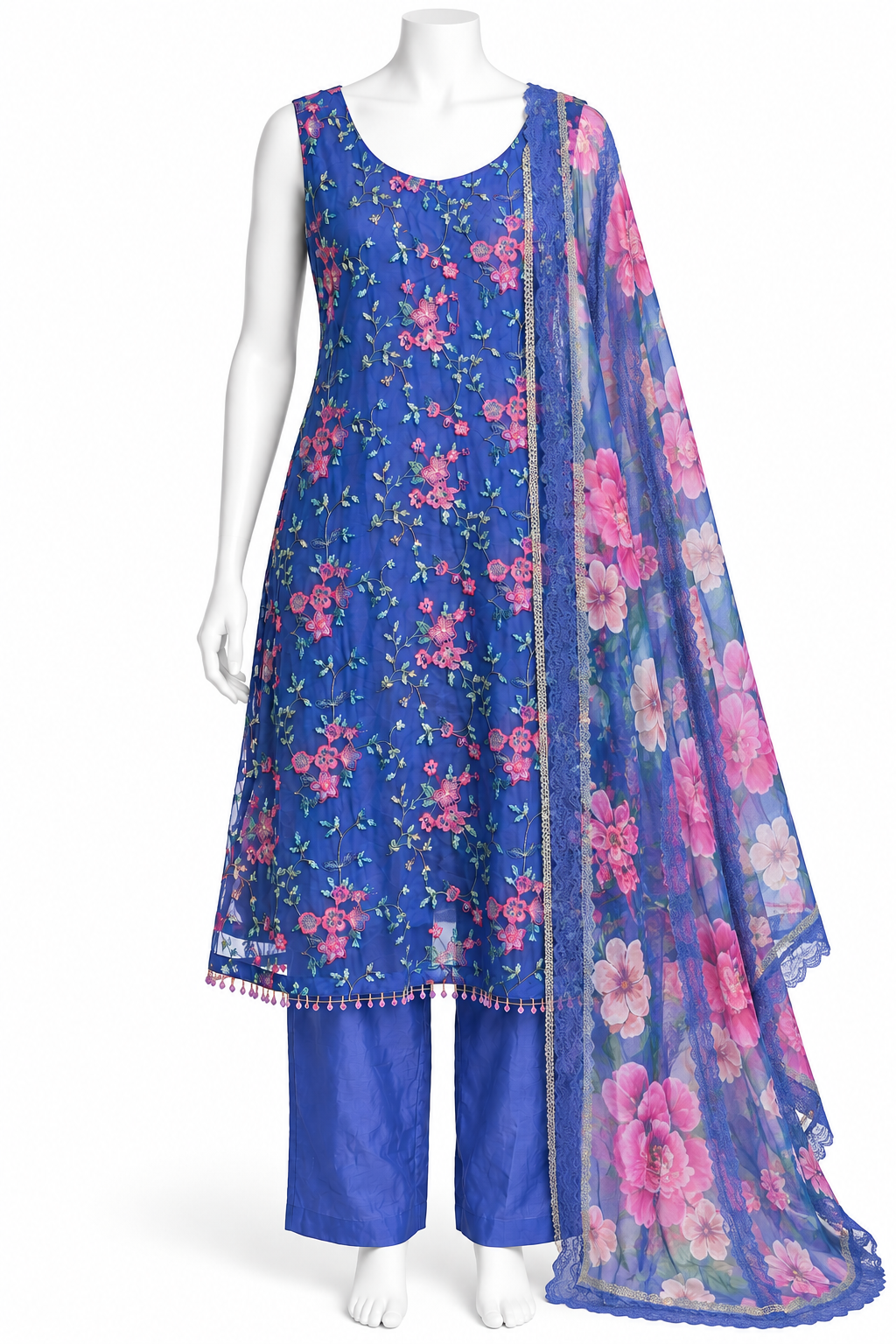 A blue three-piece salwar kameez suit set displayed on a white mannequin. The set includes a sleeveless blue kameez top with pink floral embroidery, matching blue trousers, and a sheer blue dupatta with large pink floral prints and a gold border.