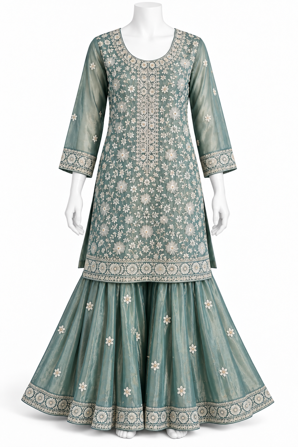 A three-piece traditional Indian outfit displayed on a white mannequin, featuring a dusty teal-green kurta with intricate white floral embroidery, a matching flared skirt, and a coordinating belt.