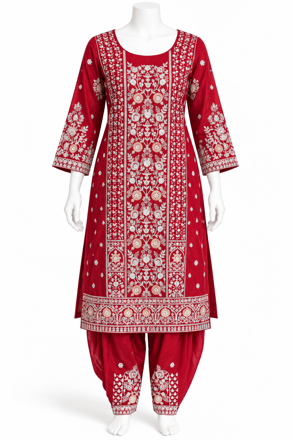 A red Indian ethnic suit set displayed on a white mannequin, featuring a heavily embroidered kurta with matching patola-style pants. The embroidery is detailed in white and gold, showcasing intricate floral and geometric patterns.