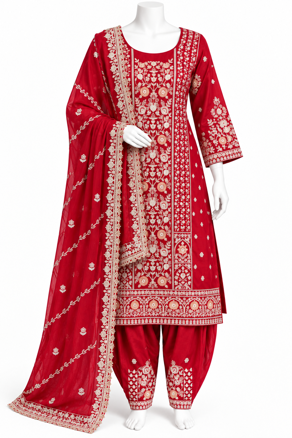 A red Indian ethnic suit set displayed on a white mannequin, featuring a heavily embroidered kurta, matching pants, and a coordinating dupatta with intricate gold and beige floral patterns.