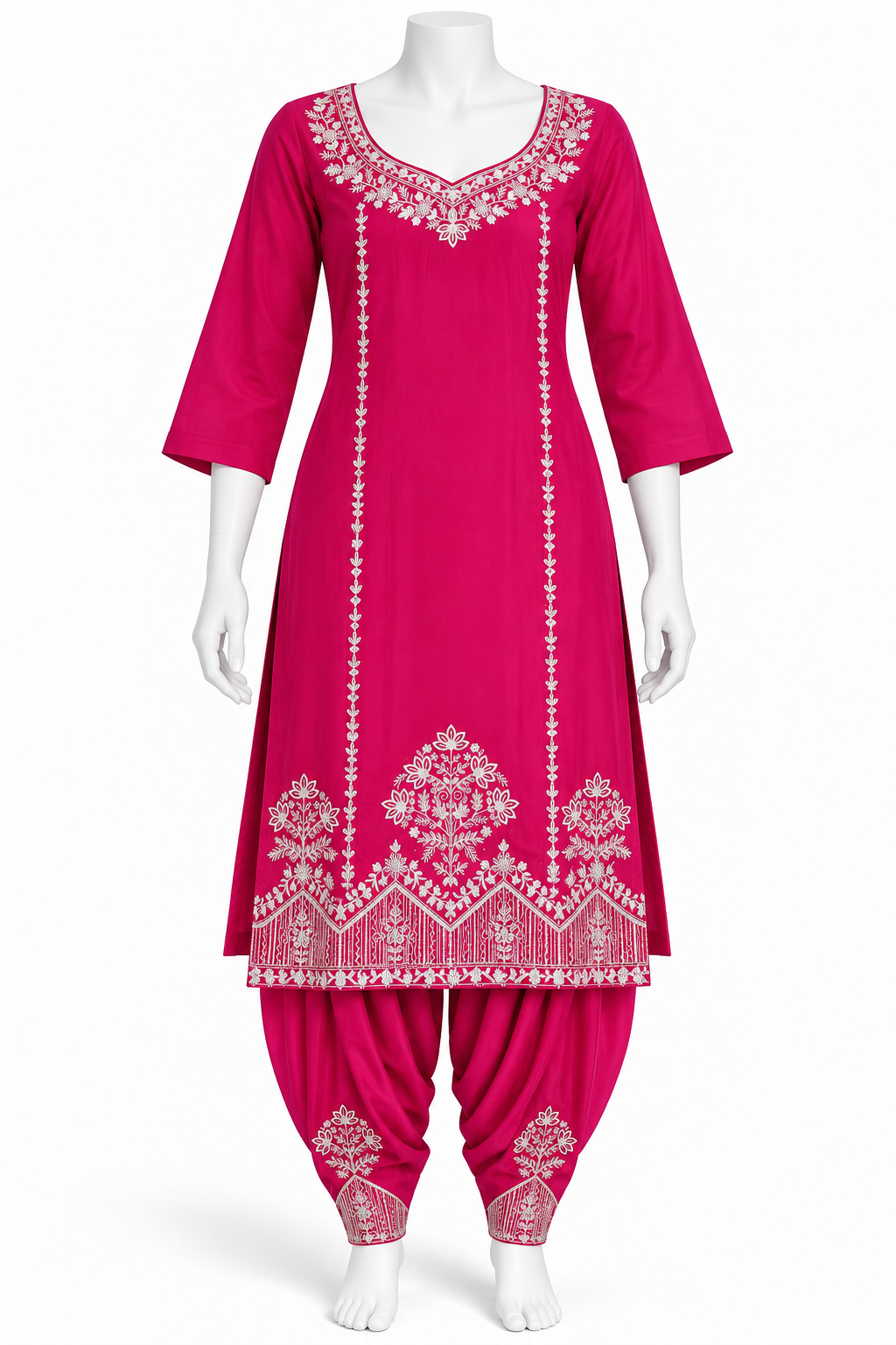 A bright pink traditional Indian salwar kameez set displayed on a white mannequin. The set includes a long tunic with white embroidered patterns and matching flared pants with embroidered cuffs.
