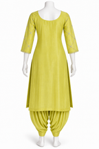 A bright yellow-green kurta and pant set displayed on a white mannequin against a plain white background. The kurta has three-quarter sleeves with subtle embroidered detailing, and the matching pants are gathered at the ankles.