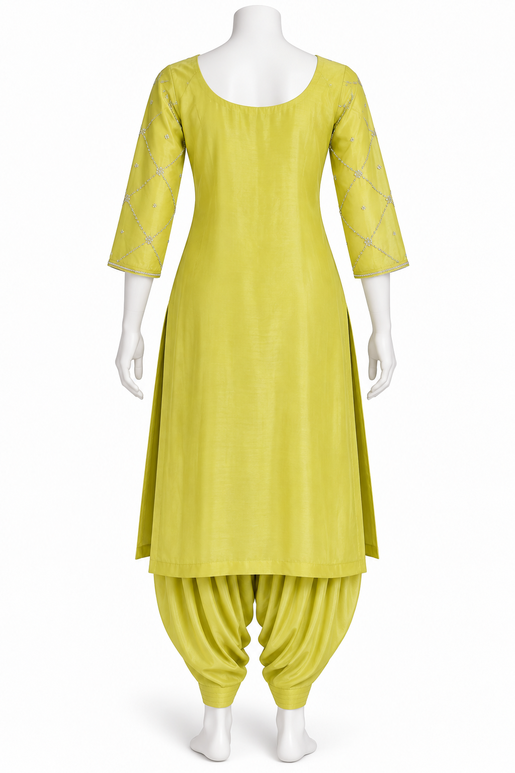 A bright yellow-green kurta and pant set displayed on a white mannequin against a plain white background. The kurta has three-quarter sleeves with subtle embroidered detailing, and the matching pants are gathered at the ankles.