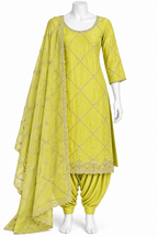 A three-piece Indian ethnic outfit in a vibrant yellow-green (lime/chartreuse) color, displayed on a white mannequin. The set includes a kurta with silver embroidery, matching pants, and a dupatta with a diamond pattern.