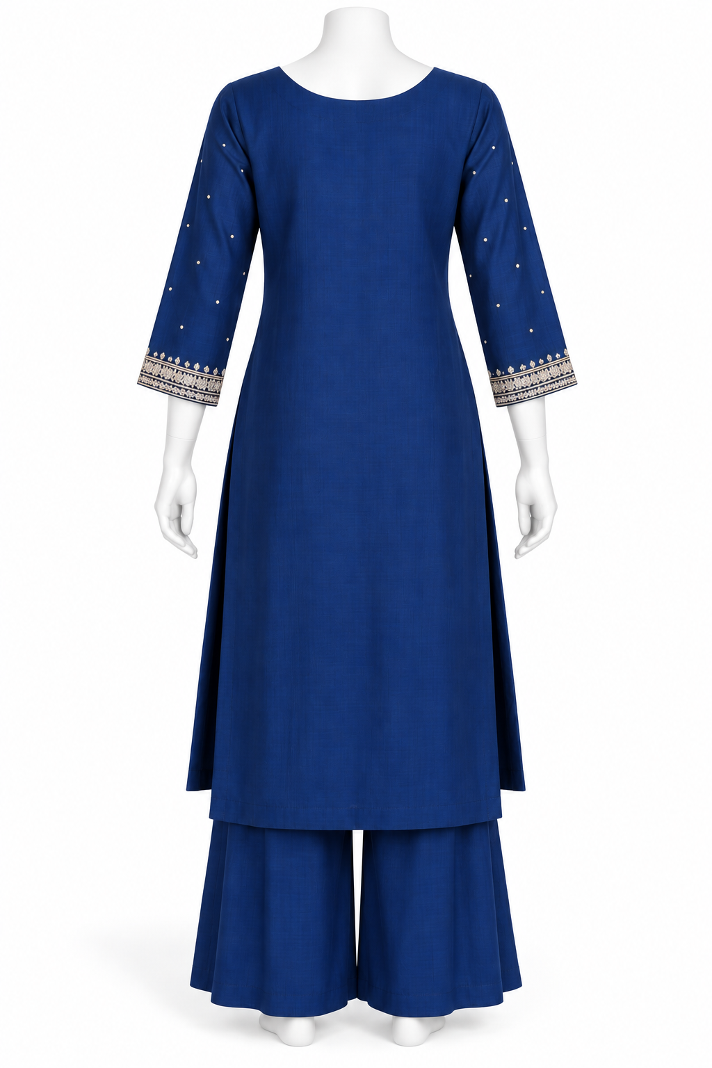 A royal blue three-piece kurta set displayed on a white mannequin, featuring a straight-neck long kurta with three-quarter sleeves decorated with small gold dots and a patterned border, matching flared pants, and a coordinating belt.