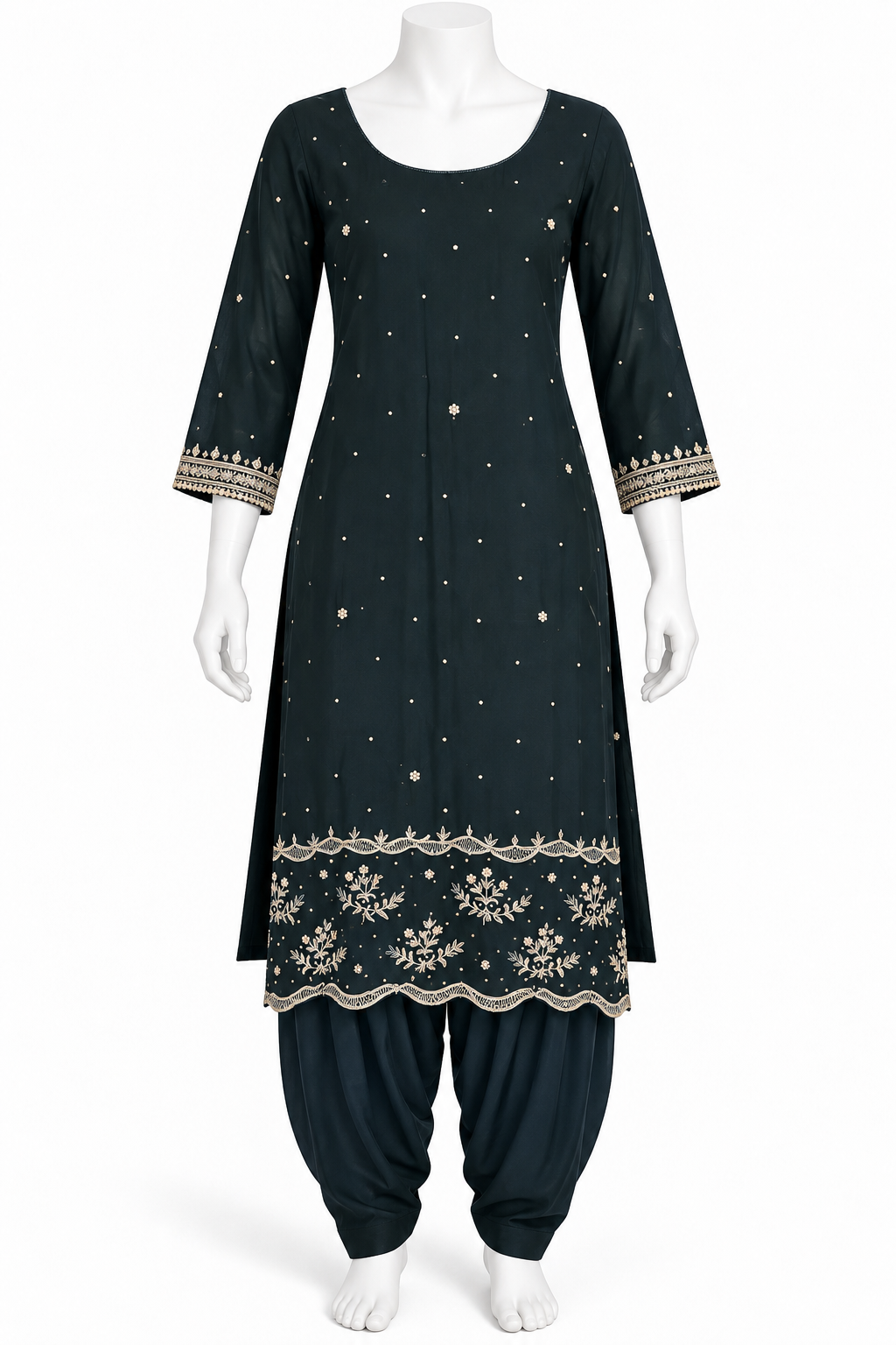 A dark teal-green Indian ethnic kurta set displayed on a white mannequin, featuring a long tunic with gold embroidery, dot patterns, and a floral border, paired with matching flared pants.