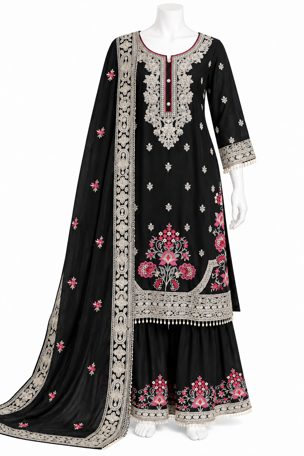 A black three-piece traditional South Asian outfit set displayed on a white mannequin, featuring a long kurta with silver and pink floral embroidery, matching flared sharara pants, and a coordinating dupatta.