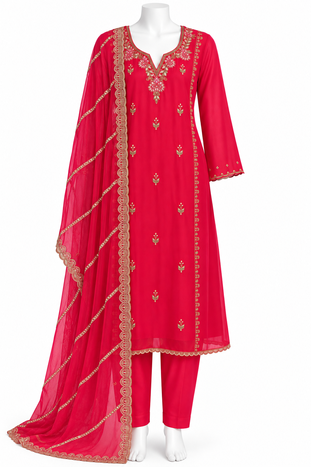 A bright pinkish-red Indian ethnic suit set displayed on a white mannequin, featuring a kurta with gold embroidery, matching trousers, and a sheer dupatta with gold border detailing.