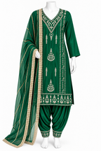 A green traditional outfit displayed on a white mannequin against a plain white background. The set includes a long embroidered tunic, matching pants, and a draped dupatta with ornate metallic detailing.