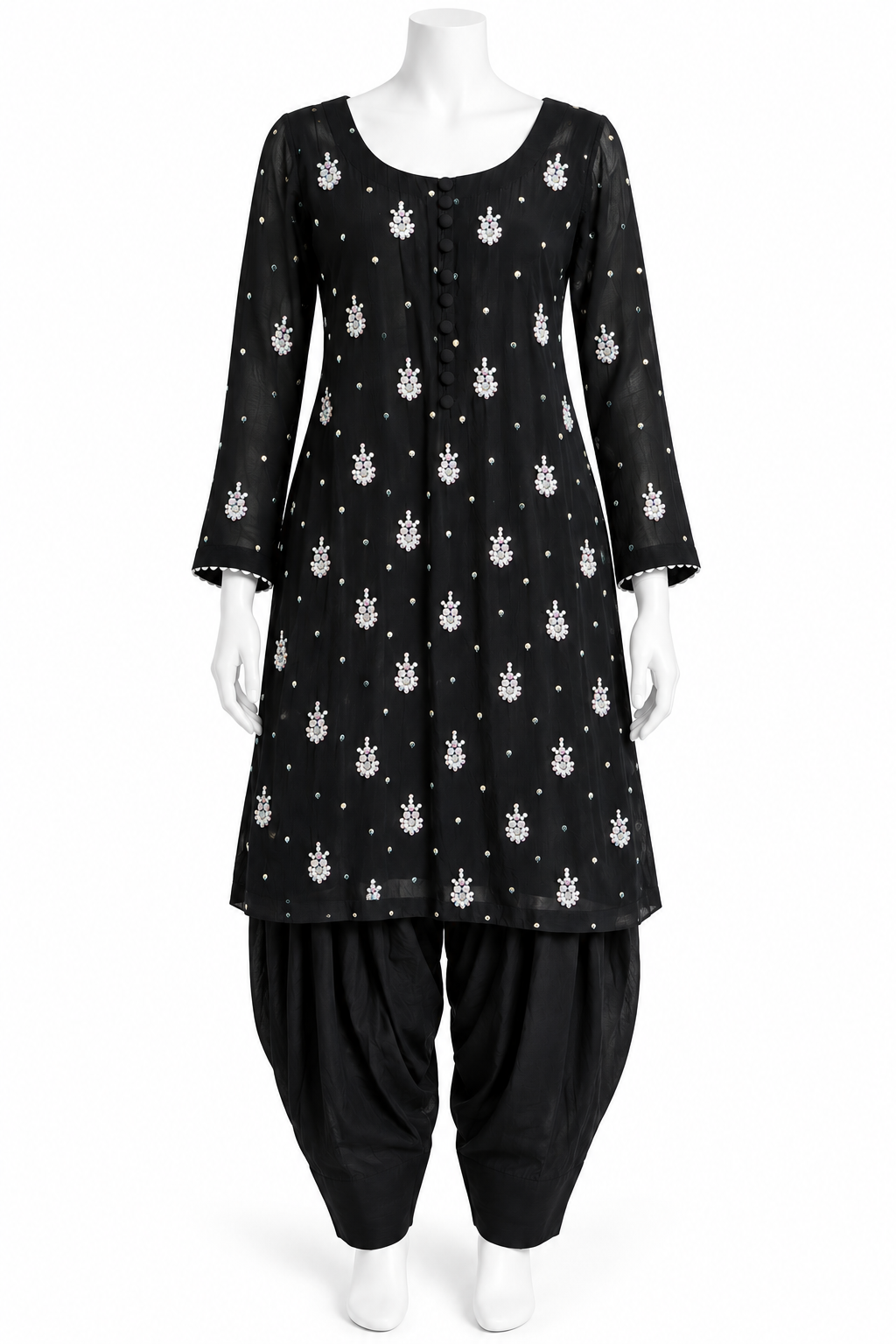 A black three-quarter sleeve kurta with a white printed pattern, paired with black patola pants, displayed on a white mannequin against a plain white background.