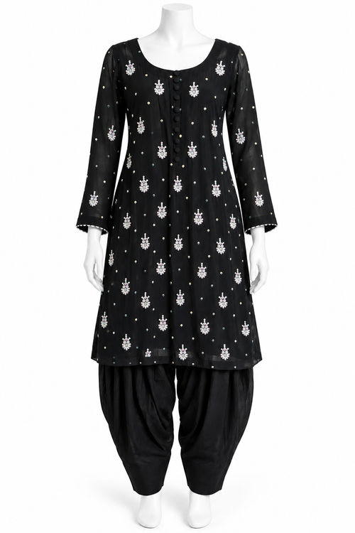 A black three-quarter sleeve kurta with a white printed pattern, paired with black patola pants, displayed on a white mannequin against a plain white background.