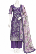 A purple three-piece salwar kameez suit displayed on a white mannequin. The set includes a purple kurta with silver floral embroidery, matching purple trousers, and a sheer floral dupatta with a purple border.