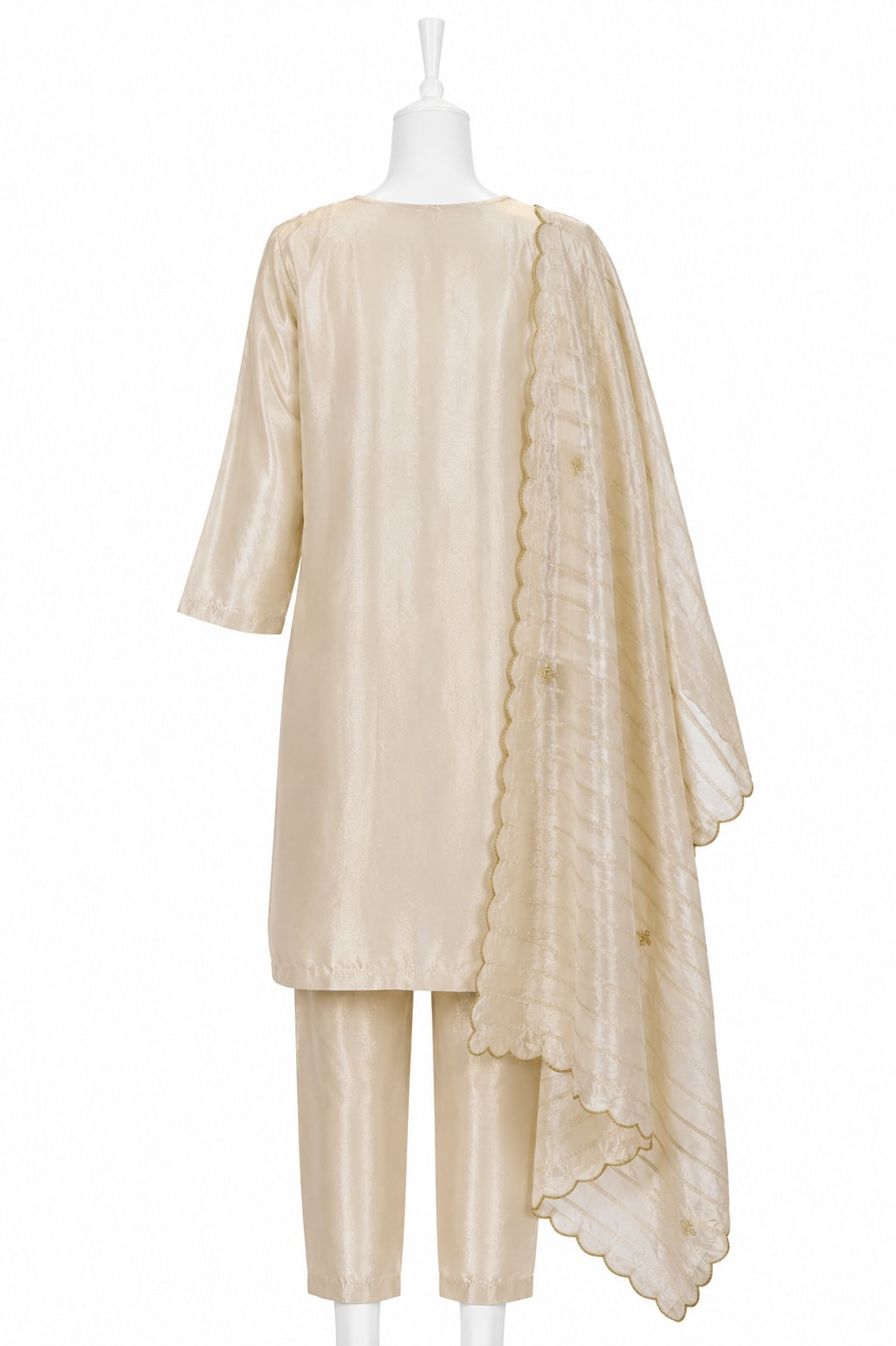 Beige outfit with a matching shawl on a mannequin against a white background