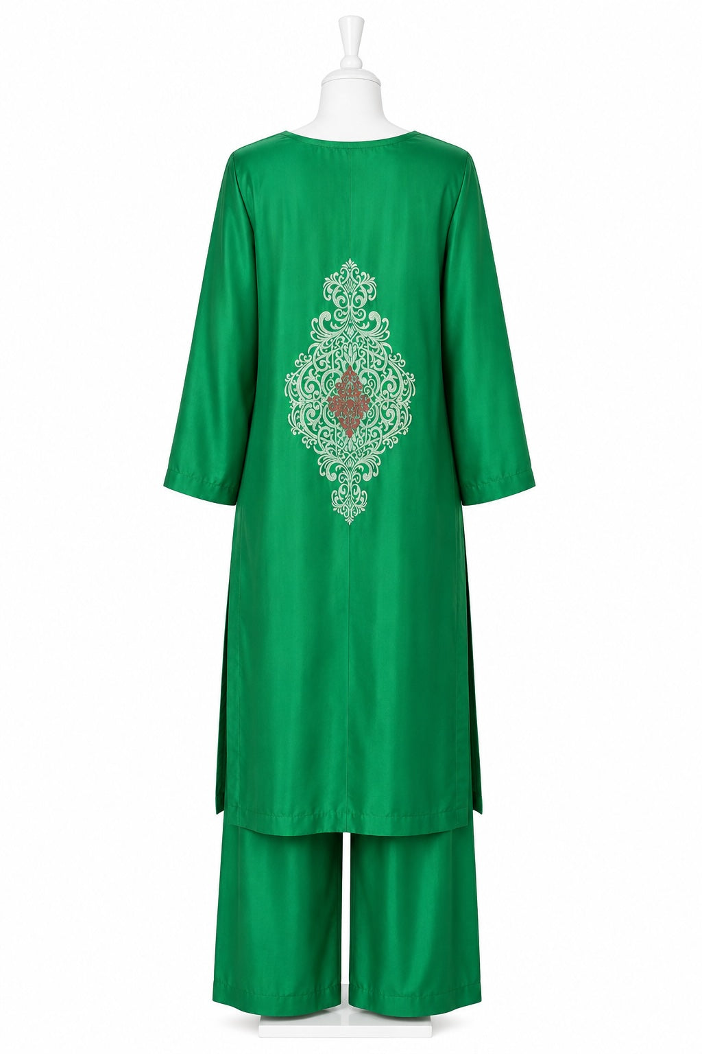 Green outfit with intricate embroidery on a white background