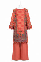Coral-colored traditional outfit with intricate patterns on a white background