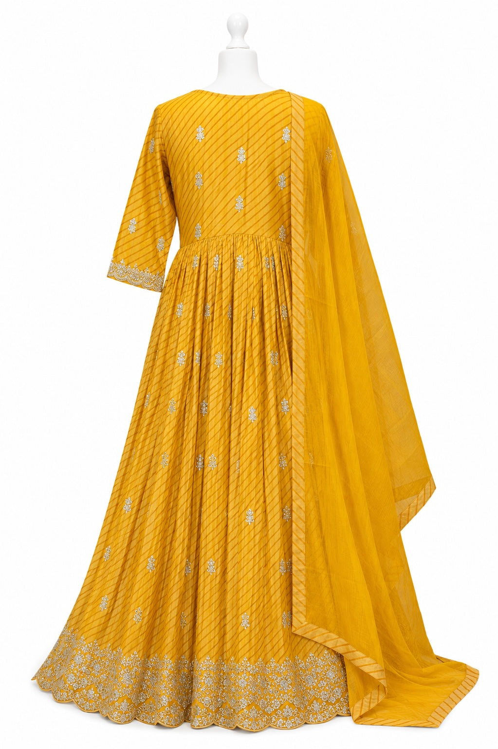 Yellow traditional outfit with intricate patterns on a white background