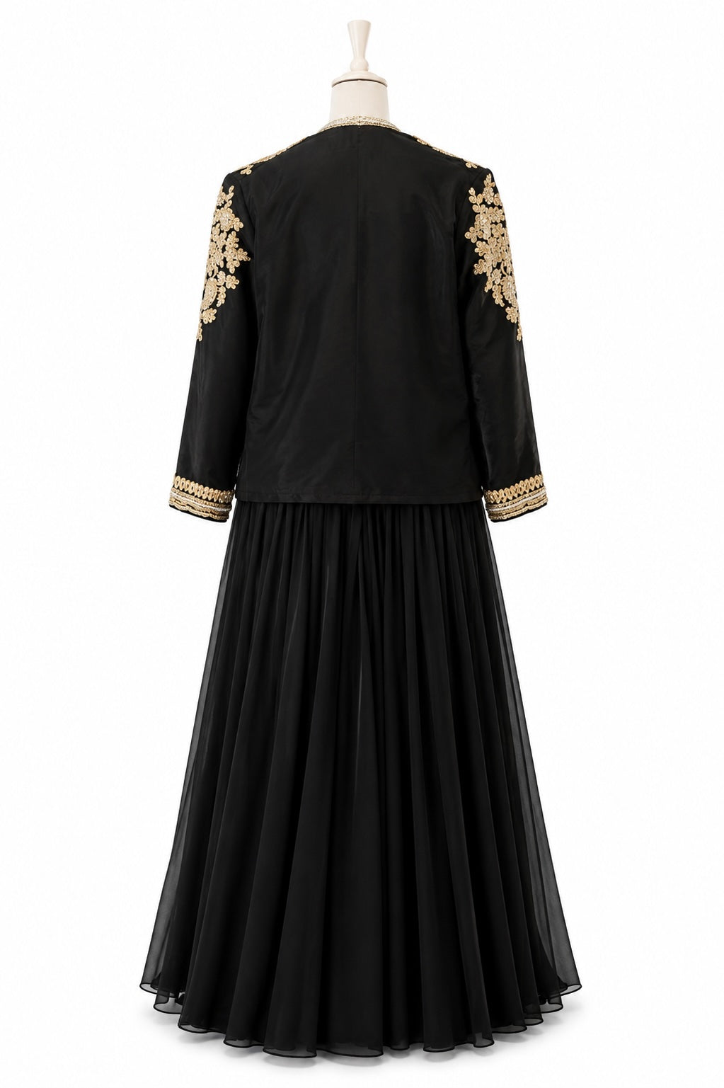 Black dress with gold embroidery on sleeves and hem on a mannequin against a white background