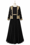 Black dress with gold embroidery on a mannequin against a white background