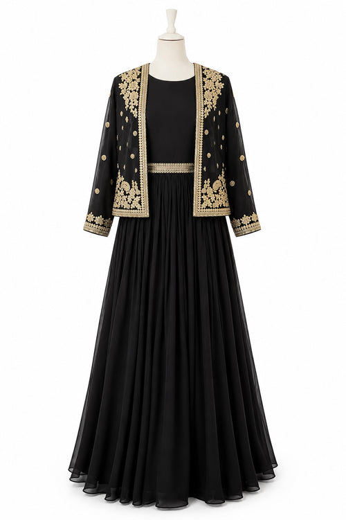 Black dress with gold embroidery on a mannequin against a white background