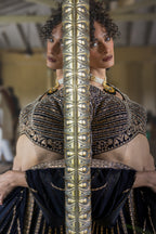 Close-up of gold embroidered black lehenga blouse with intricate detailing – Khush Mizaj