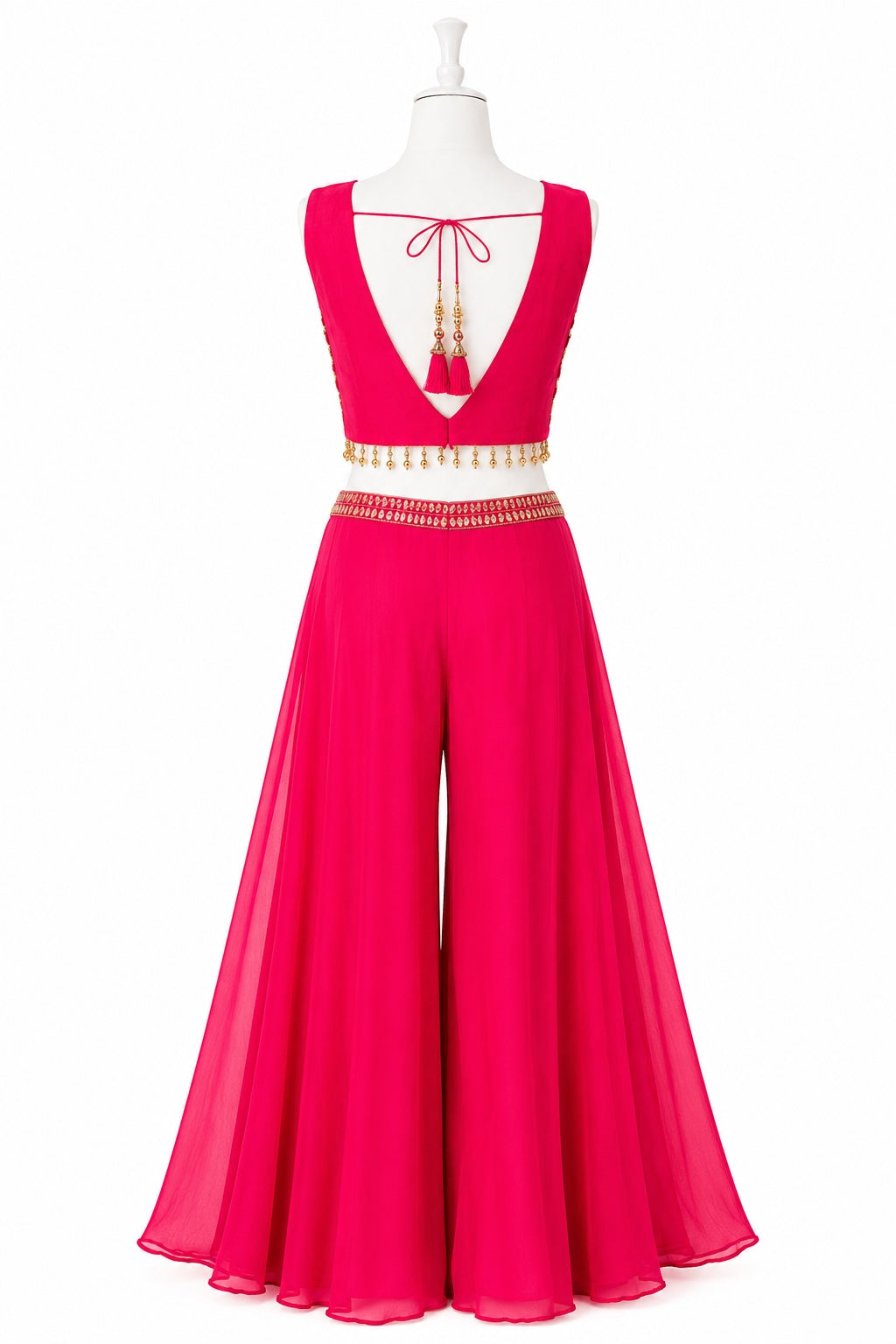 Pink evening gown with gold embellishments on a mannequin against a white background