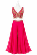 Pink outfit with embroidered top on a white background