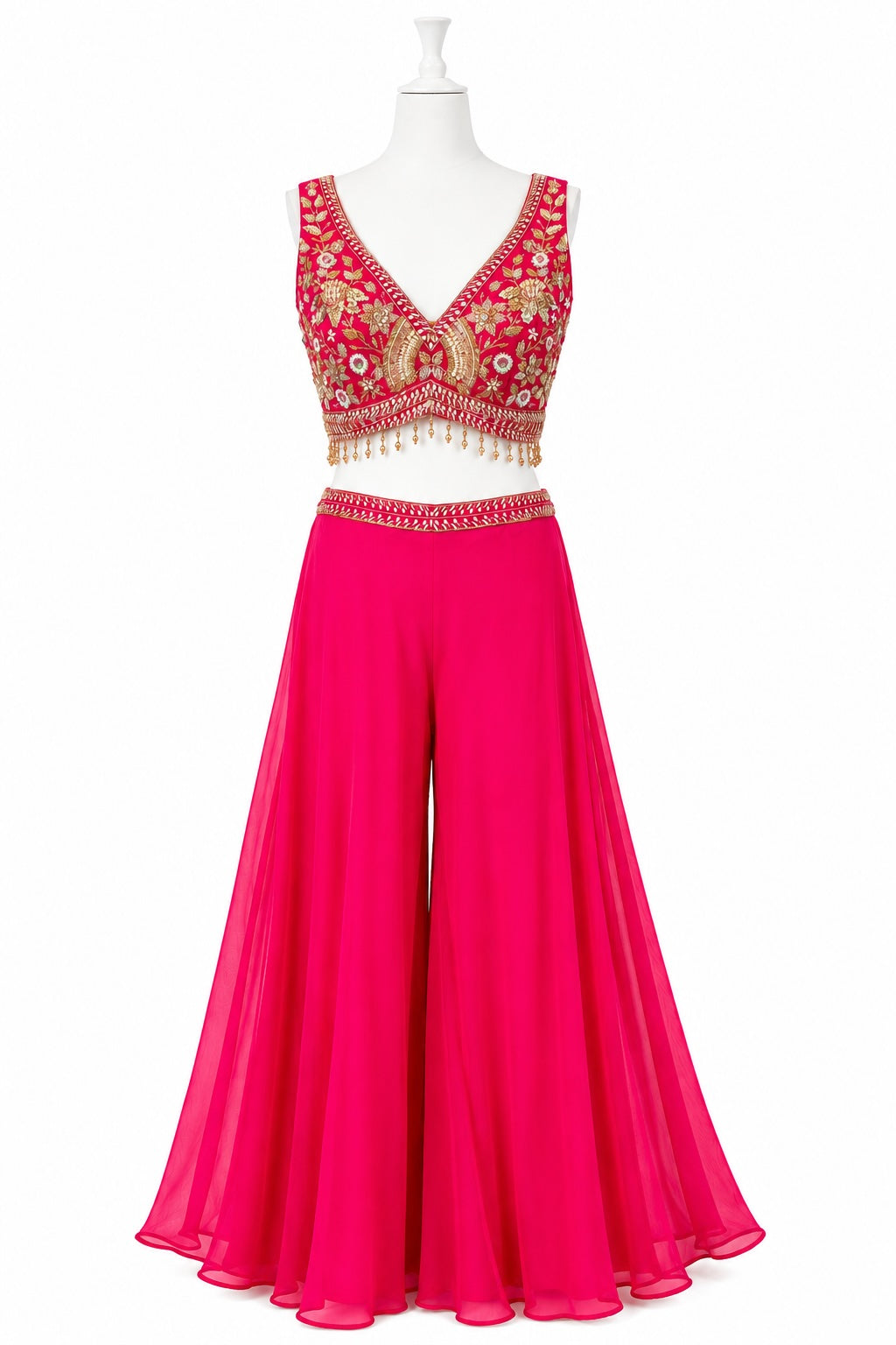 Pink outfit with embroidered top on a white background