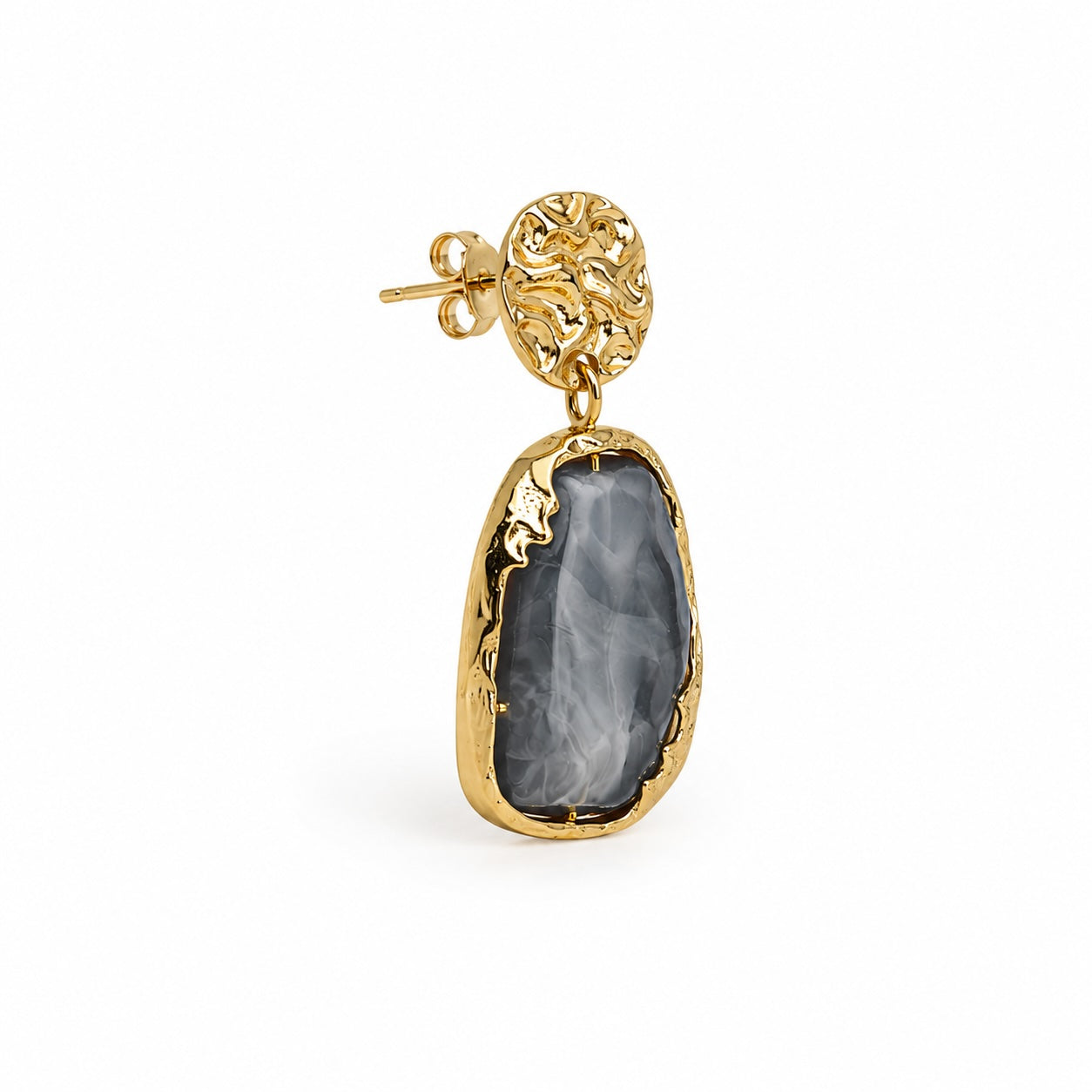 A gold drop earring featuring a textured, organic-shaped gray stone pendant, shown on a clean white background.