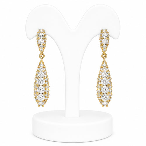 Gold earrings with clear stones on a white stand