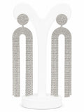Pair of silver tassel earrings on a white background