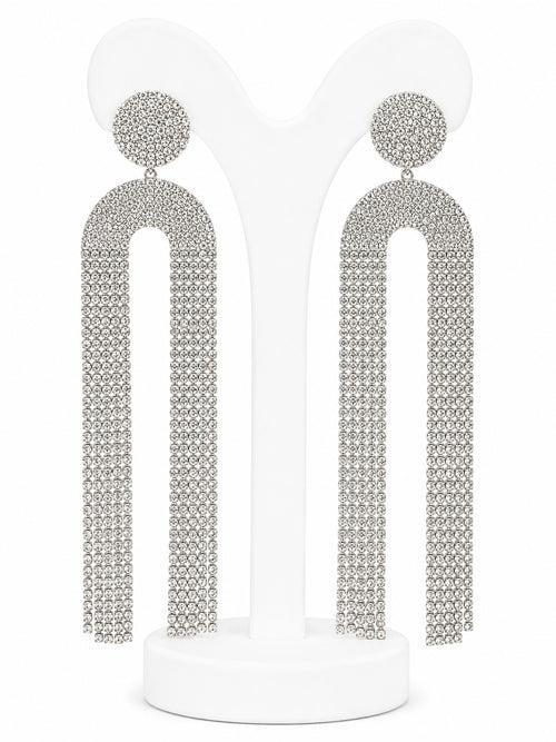 Pair of silver tassel earrings on a white background