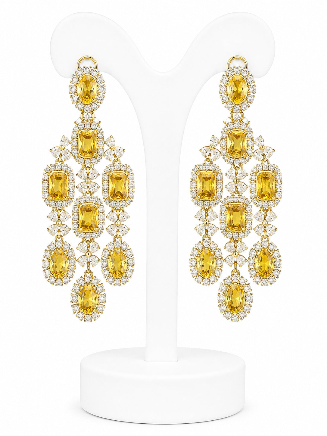 Pair of yellow gemstone chandelier earrings on a white background
