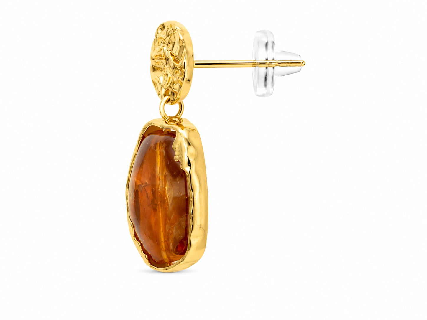 Gold earrings with brown stone drops on a white stand