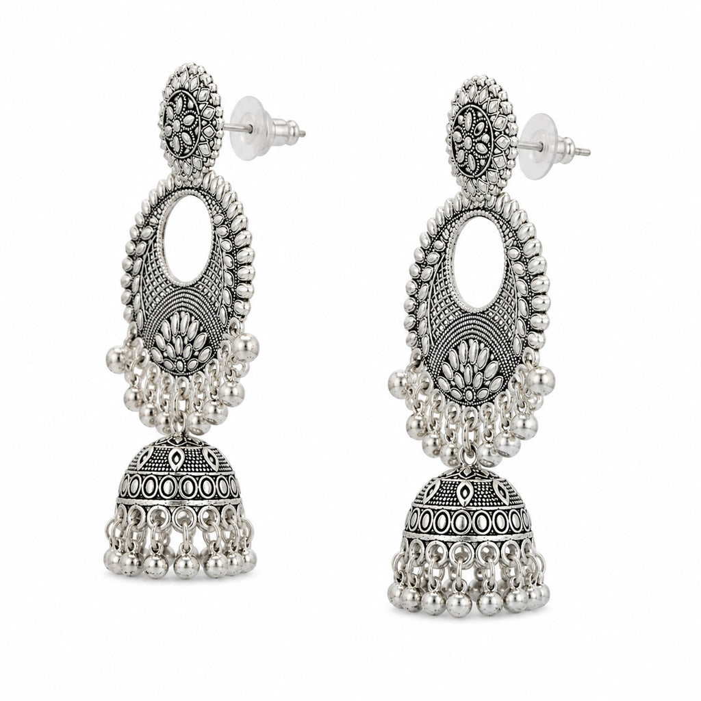 Pair of silver jhumka earrings on a white background