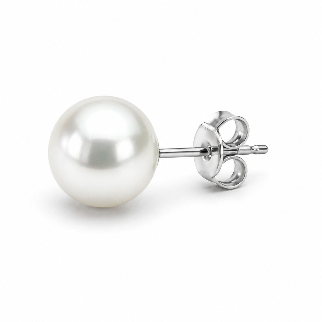 Pearl earring with silver clip on a white background
