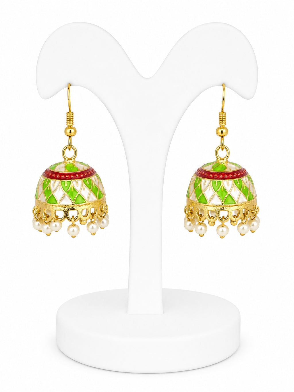Pair of gold and green earrings on a white stand