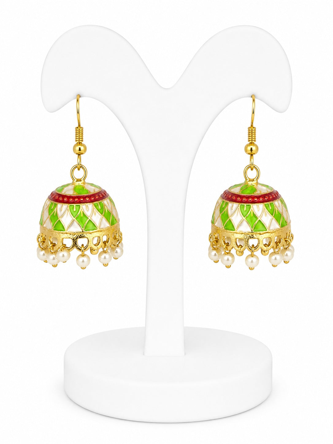 Pair of gold and green earrings on a white stand