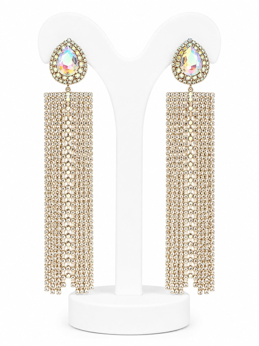 Gold beaded earrings with teardrop-shaped gemstones on a white stand.