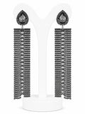 Pair of beaded earrings on a white stand