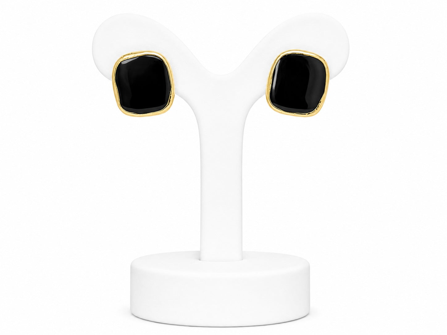 Pair of black square earrings with gold accents on a white stand.