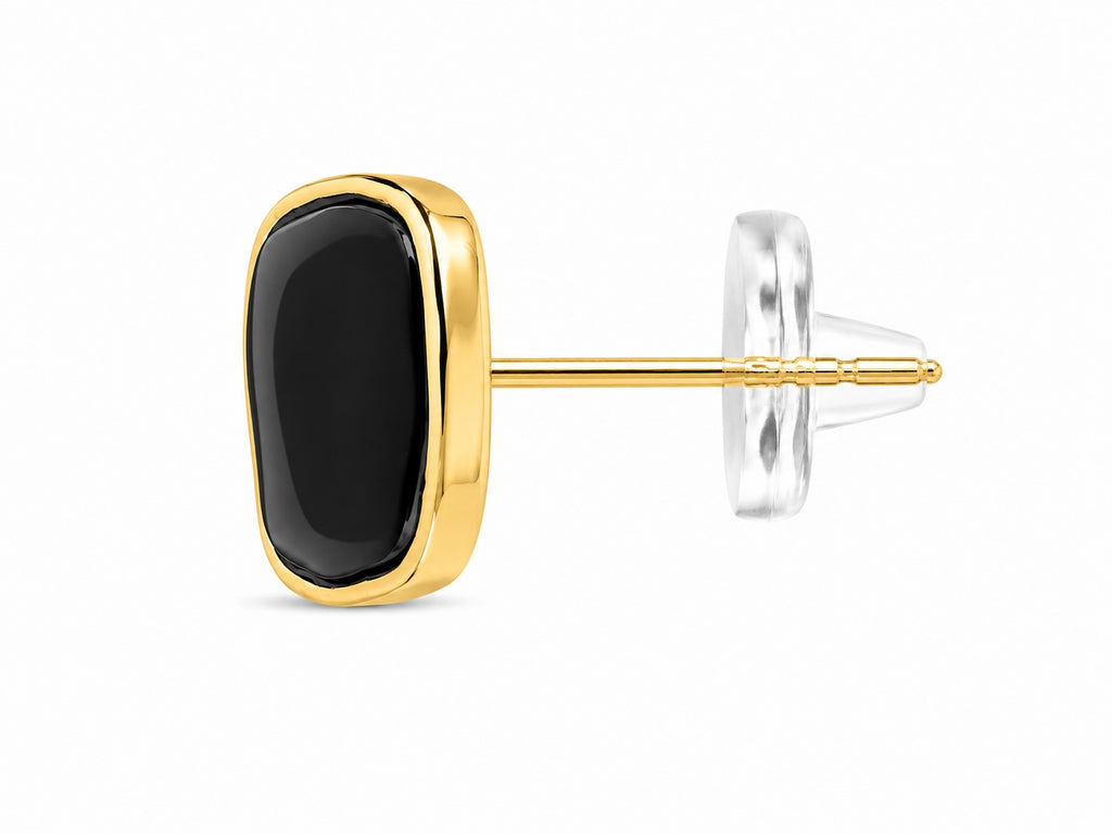 Gold and black stud earring on a white background