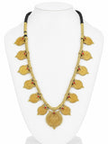 Gold necklace with leaf designs on a white stand