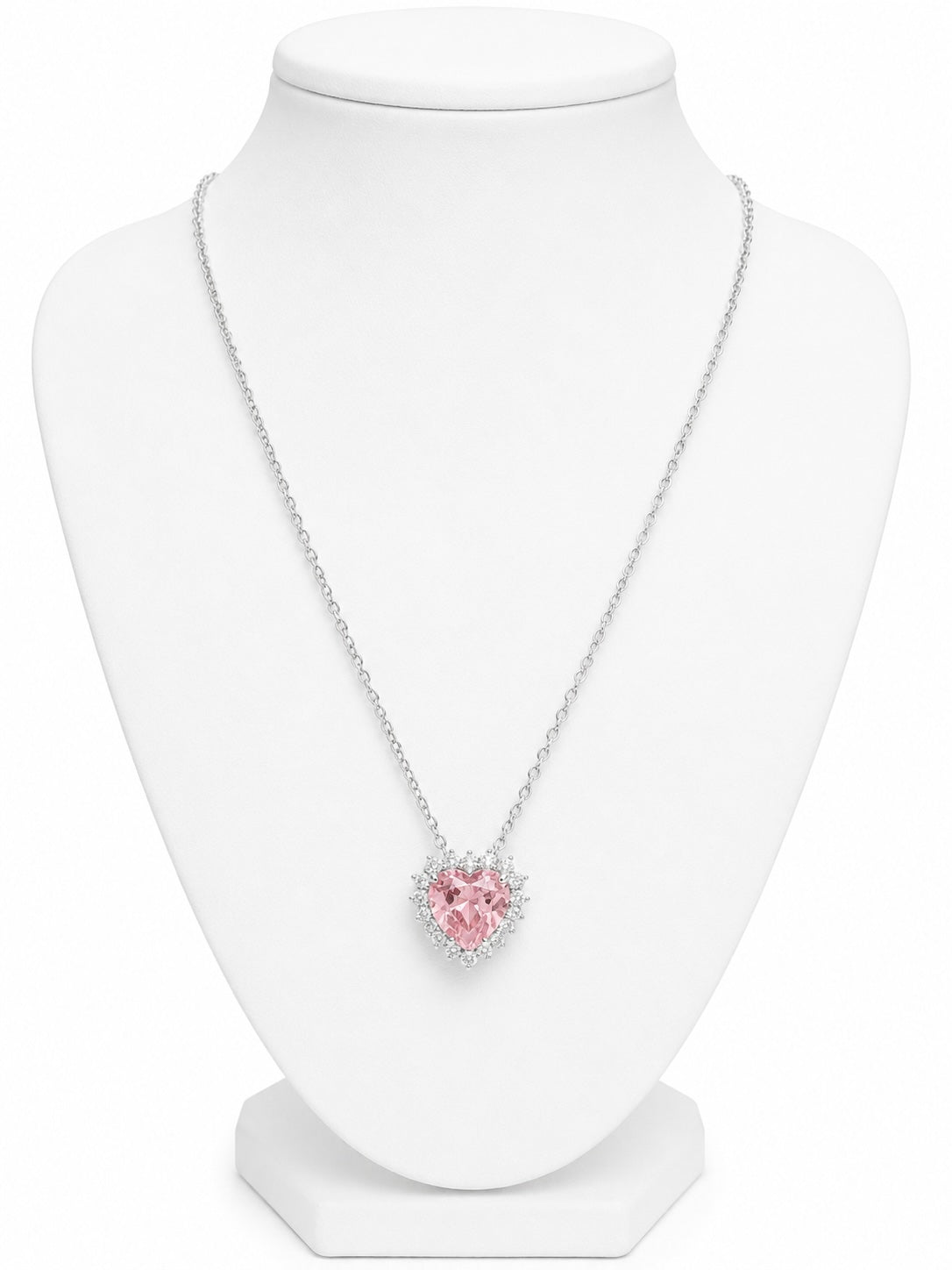 Necklace with a pink heart-shaped pendant on a white mannequin bust.