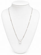 Necklace with a pendant on a white mannequin bust