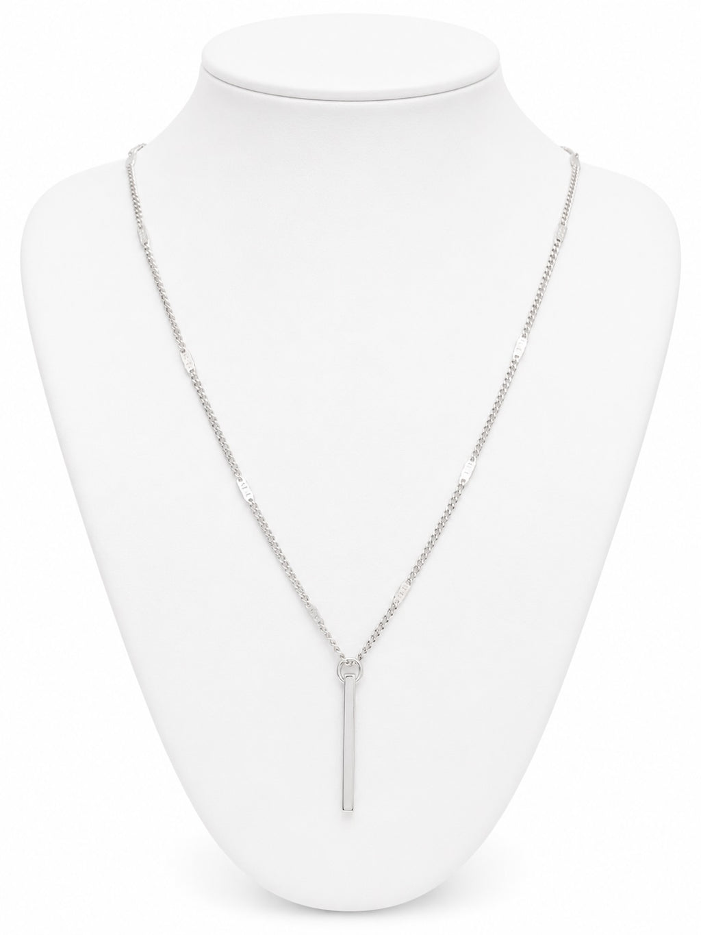 Silver necklace on a white mannequin bust