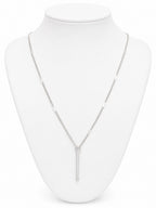 Silver necklace on a white mannequin bust