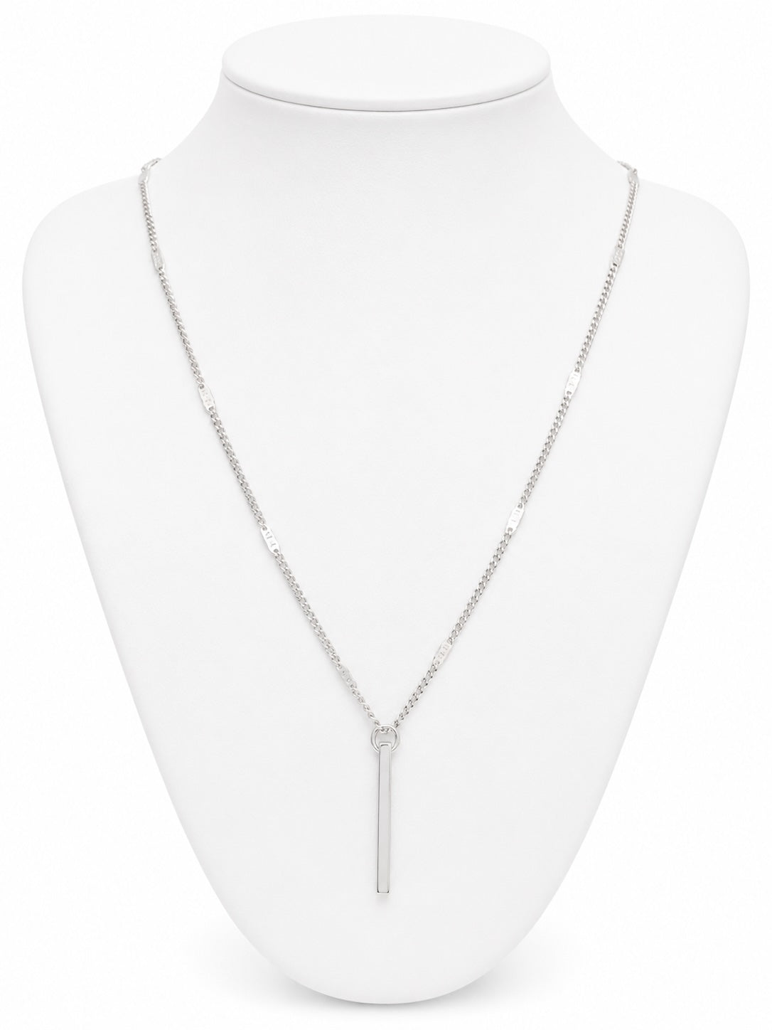 Silver necklace on a white mannequin bust