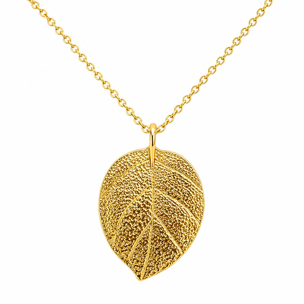 Gold leaf pendant necklace on a white background